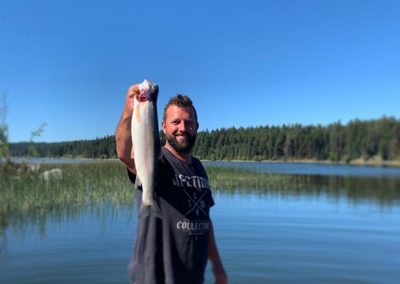 Catching beautiful rainbow trout at Roche Lake Resort